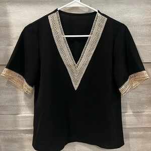 Elegant Black V-Neck Top with Cream Accents